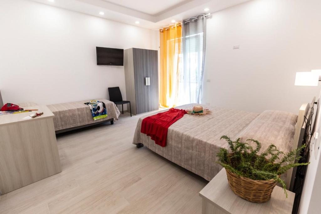 A bed or beds in a room at Incanto di luna B&b Family Rooms