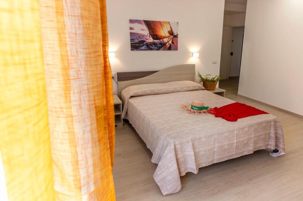 A bed or beds in a room at Incanto di luna B&b Family Rooms
