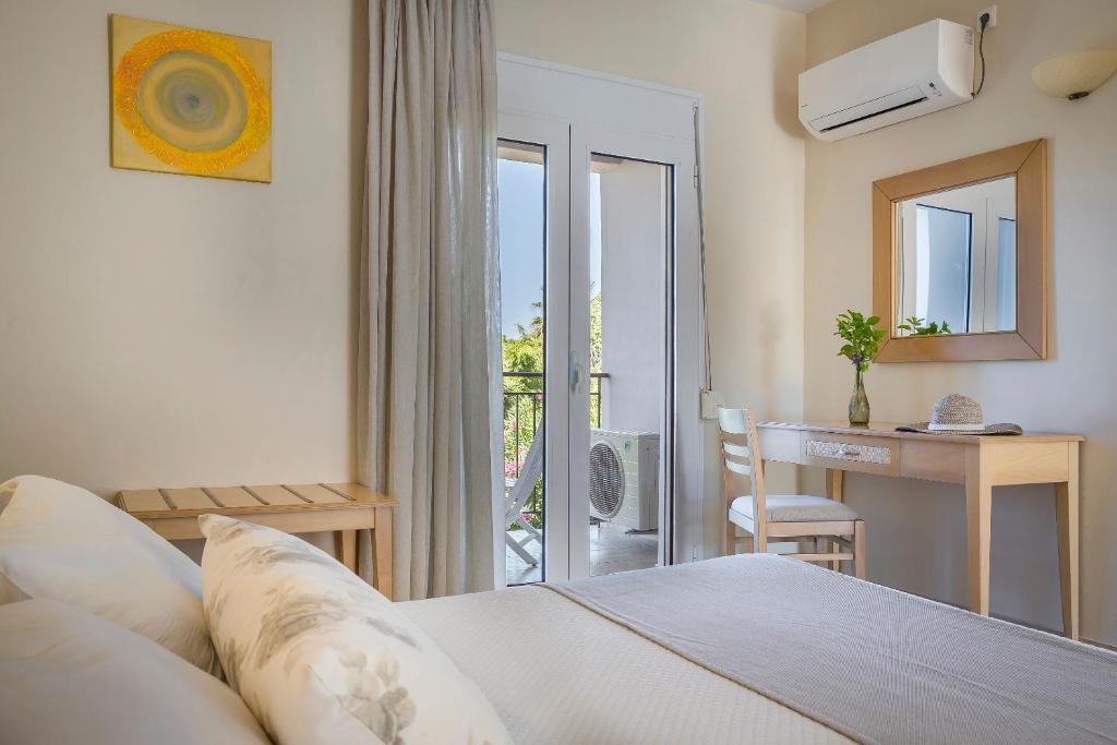 Postel nebo postele na pokoji v ubytování ASTRA Village Resort