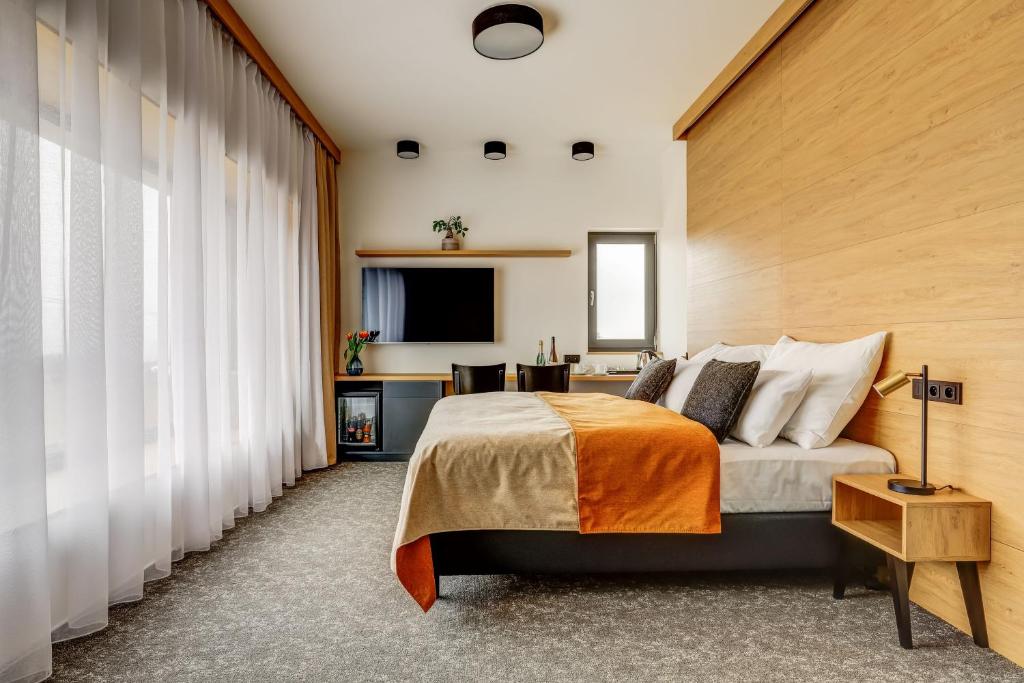 Postel nebo postele na pokoji v ubytování Hotel Maralák