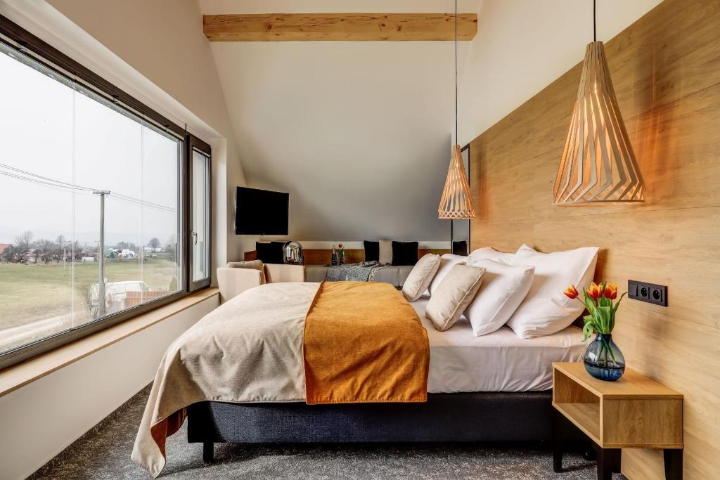 Postel nebo postele na pokoji v ubytování Hotel Maralák