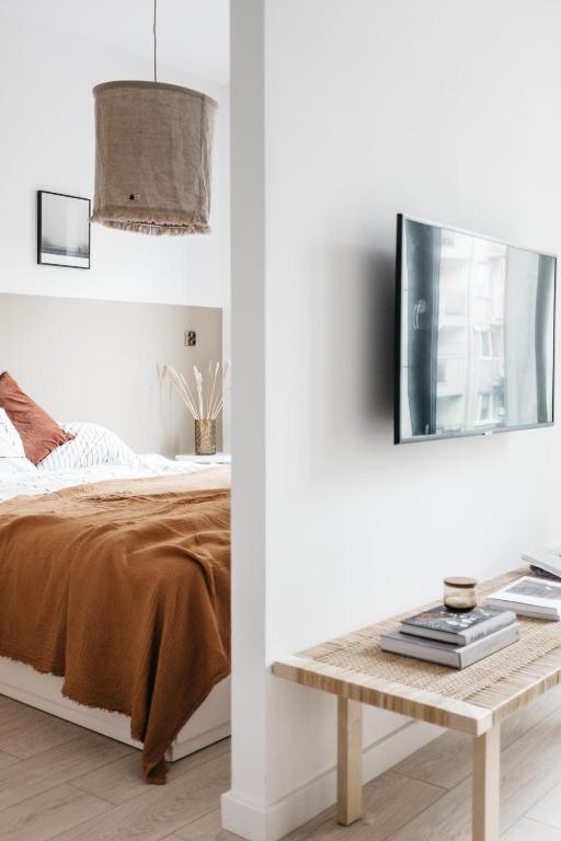 Televízia a/alebo spoločenská miestnosť v ubytovaní Powder Apartment - LoftAffair