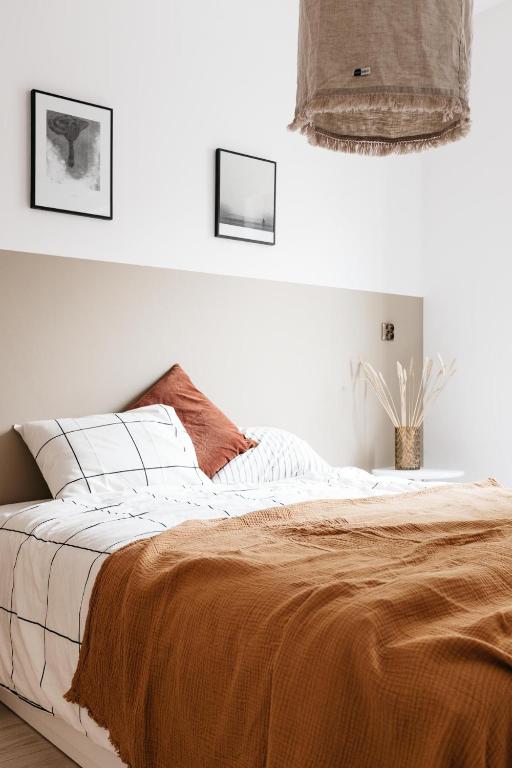 Posteľ alebo postele v izbe v ubytovaní Powder Apartment - LoftAffair