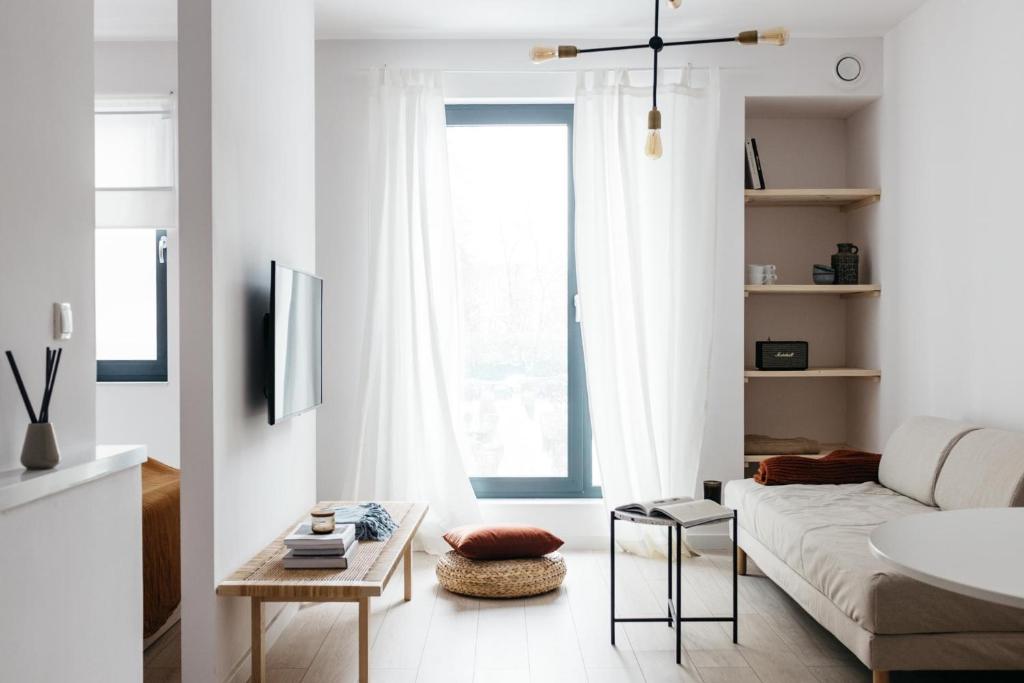 Televízia a/alebo spoločenská miestnosť v ubytovaní Powder Apartment - LoftAffair