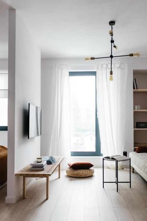 Televízia a/alebo spoločenská miestnosť v ubytovaní Powder Apartment - LoftAffair