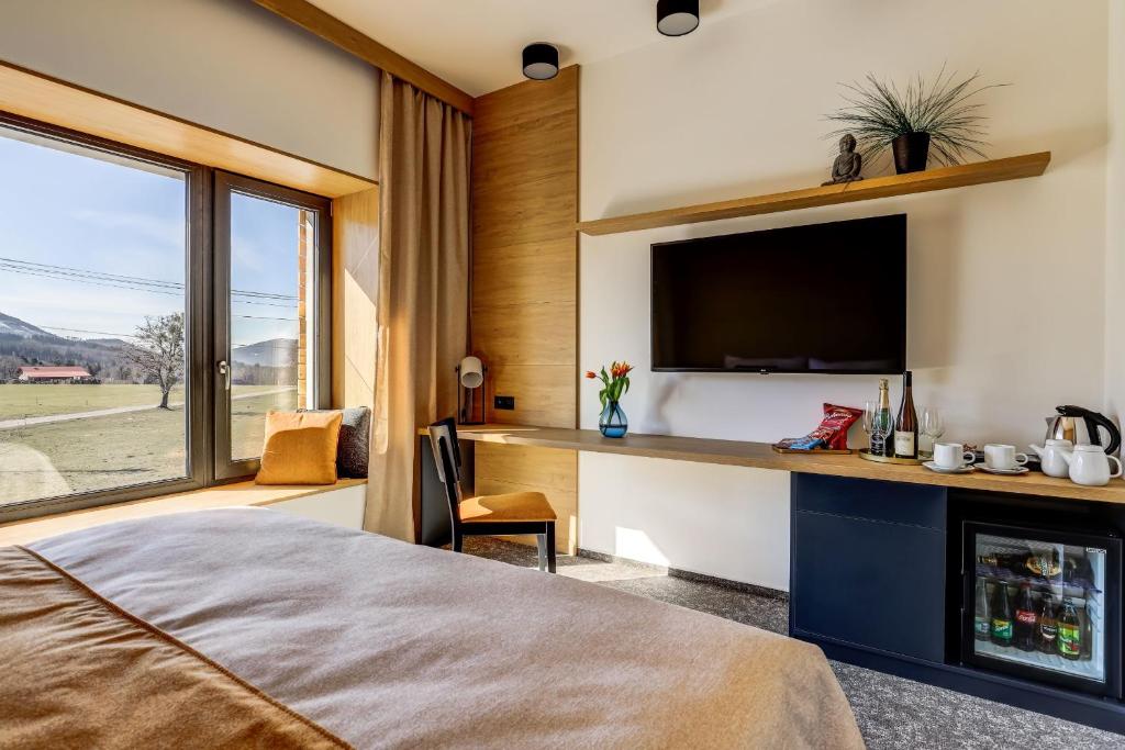 Postel nebo postele na pokoji v ubytování Hotel Maralák