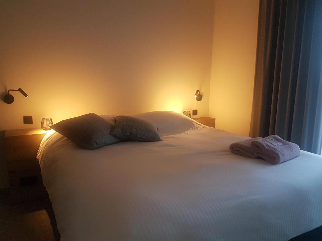 Postel nebo postele na pokoji v ubytování B&B Snelleghem