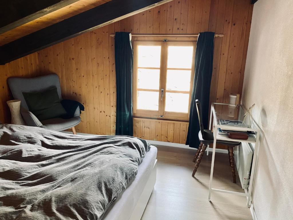 Postel nebo postele na pokoji v ubytování Chalet Amwäg