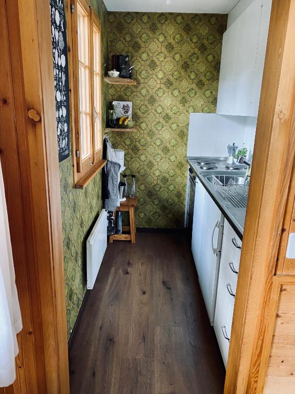 Kuchyň nebo kuchyňský kout v ubytování Chalet Amwäg
