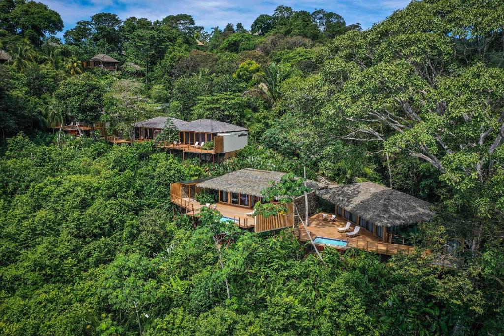 an aerial view of a house in the jungle at Lapa Rios Lodge by Böëna in Puerto Jiménez