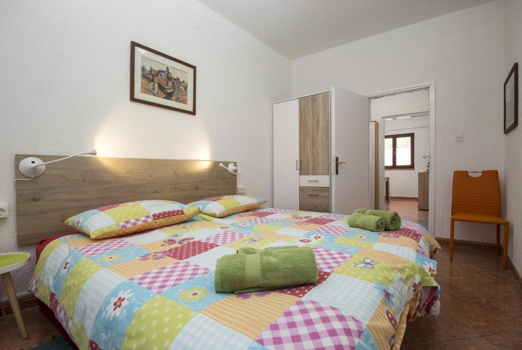 Posteľ alebo postele v izbe v ubytovaní Karmelo Appartment Davorka