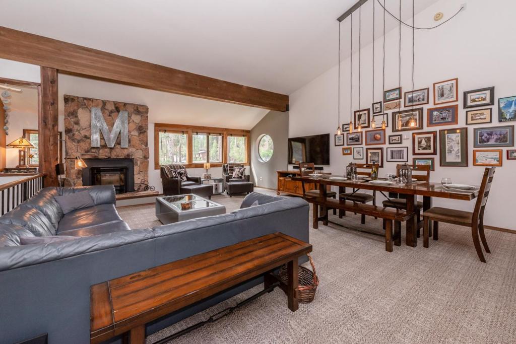a living room with a couch and a dining room at Helios 11N in Mammoth Lakes