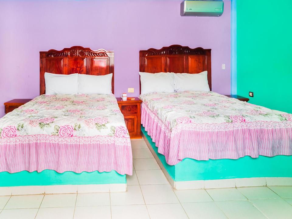 Postel nebo postele na pokoji v ubytování Hotel El Faro