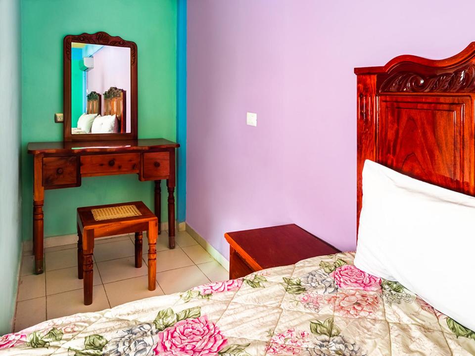 Postel nebo postele na pokoji v ubytování Hotel El Faro