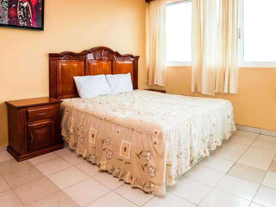 Postel nebo postele na pokoji v ubytování Hotel El Faro