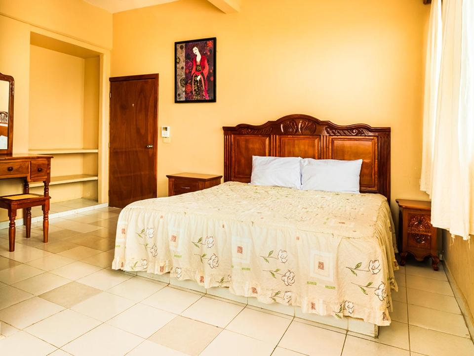Postel nebo postele na pokoji v ubytování Hotel El Faro