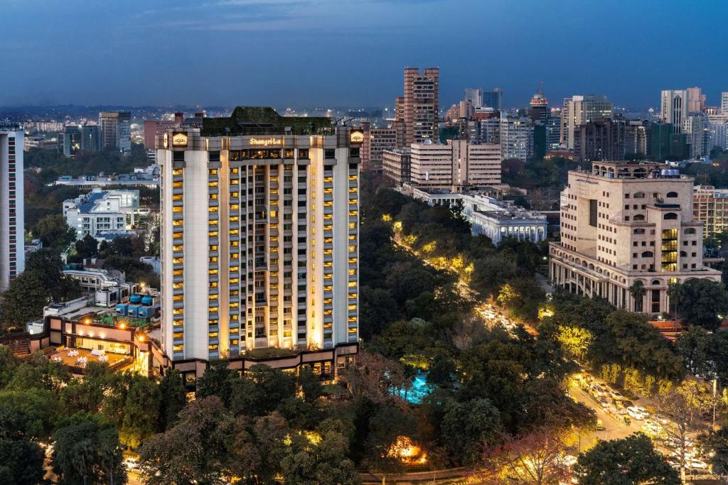 a city skyline with a large white building at Shangri-La Eros New Delhi in New Delhi