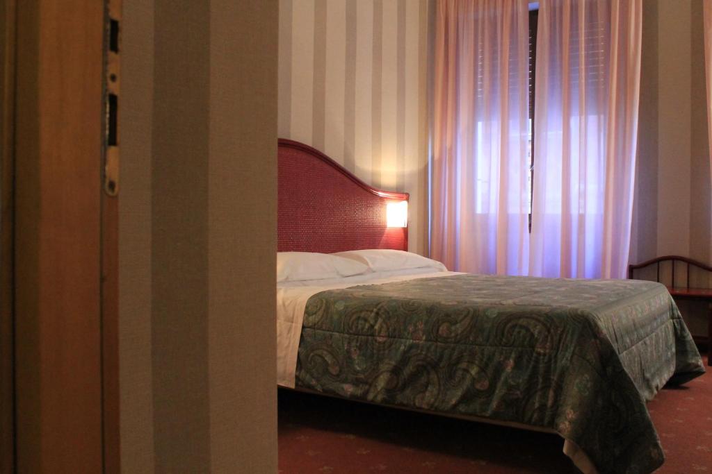 Postel nebo postele na pokoji v ubytování Hotel Kristina