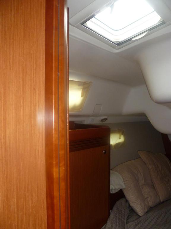 Postel nebo postele na pokoji v ubytování Le Vele Residence Sailing Boat