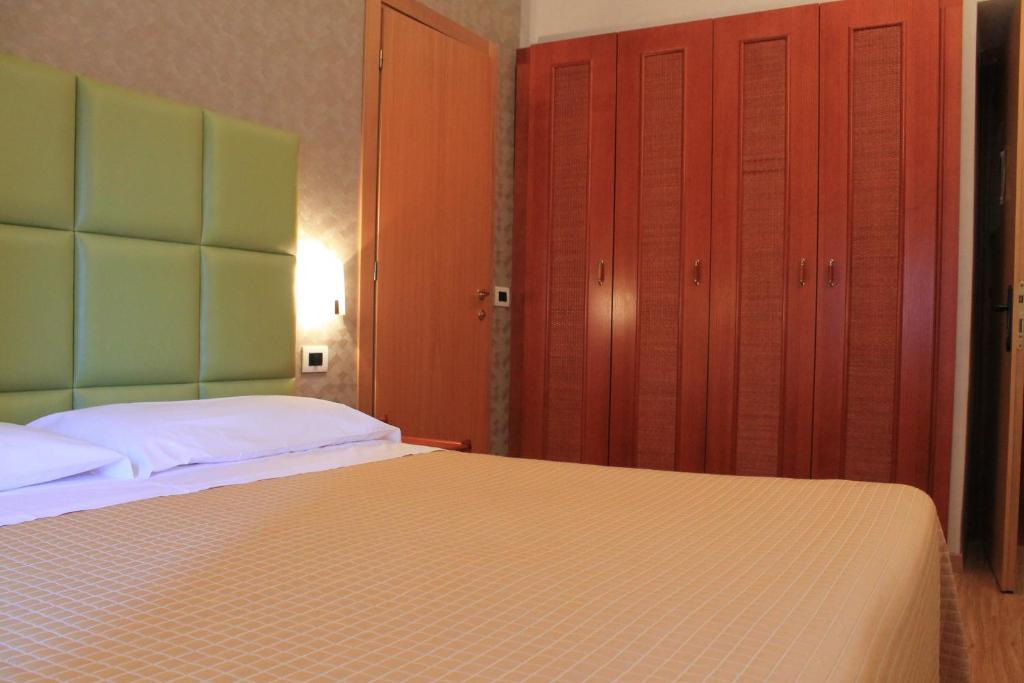 Postel nebo postele na pokoji v ubytování Hotel Kristina