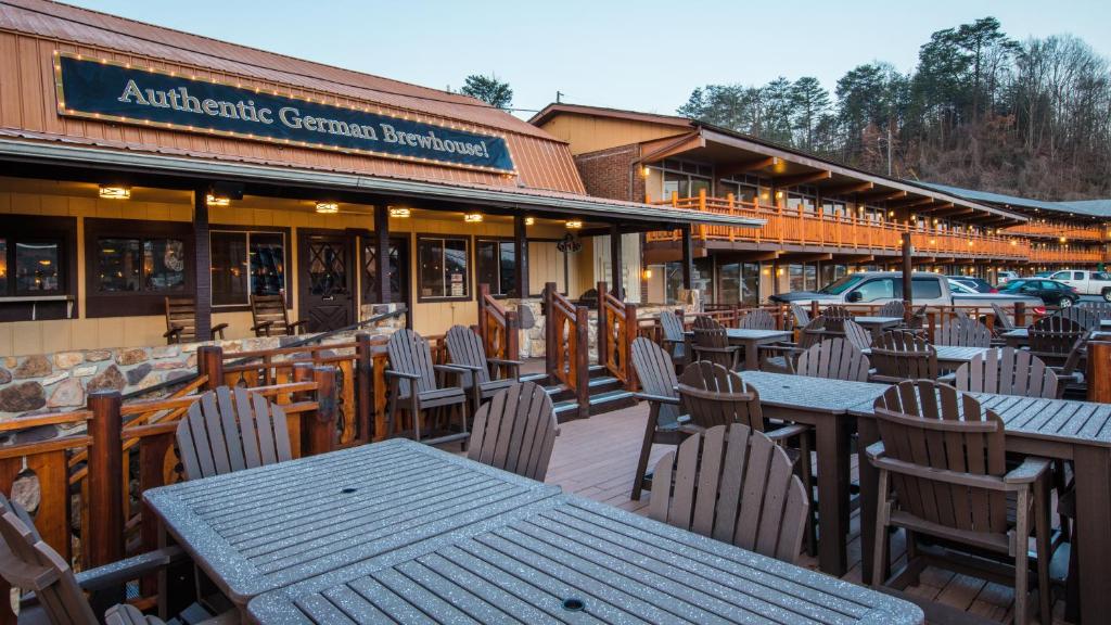 an empty restaurant with tables and chairs in front of it at Wild Bear Inn in Pigeon Forge