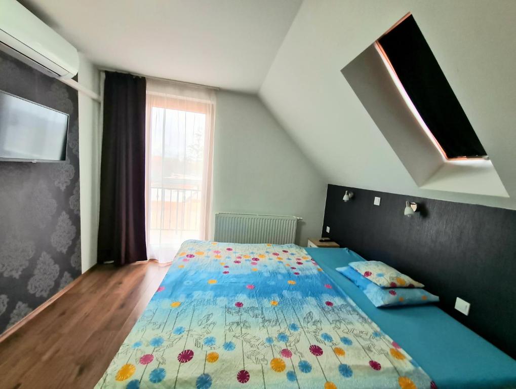 Posteľ alebo postele v izbe v ubytovaní Székely-Lak Apartman Hegykő