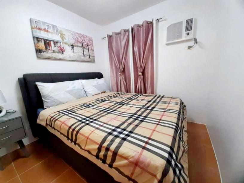 Postel nebo postele na pokoji v ubytování One Oasis By Paseo de Corazon Residence