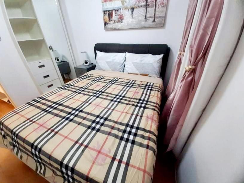Postel nebo postele na pokoji v ubytování One Oasis By Paseo de Corazon Residence