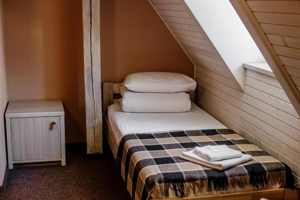 Postel nebo postele na pokoji v ubytování Guest House "Arkhistratyg"