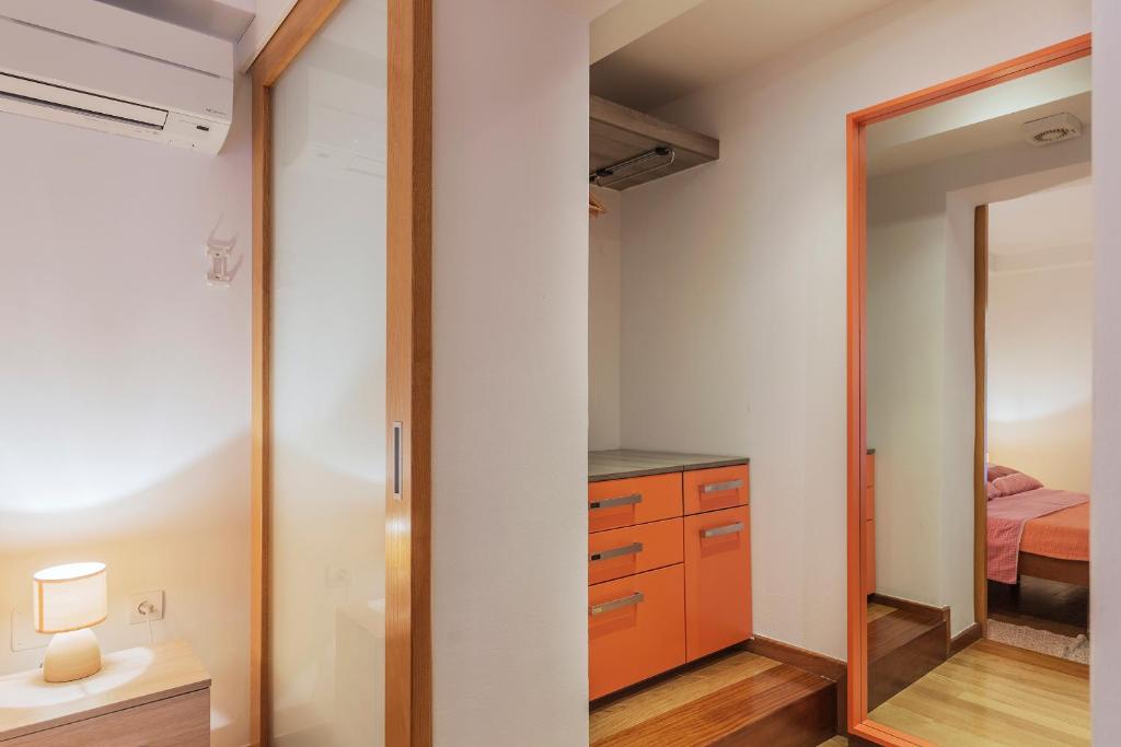 Postel nebo postele na pokoji v ubytování Apartments Villa Lungomare