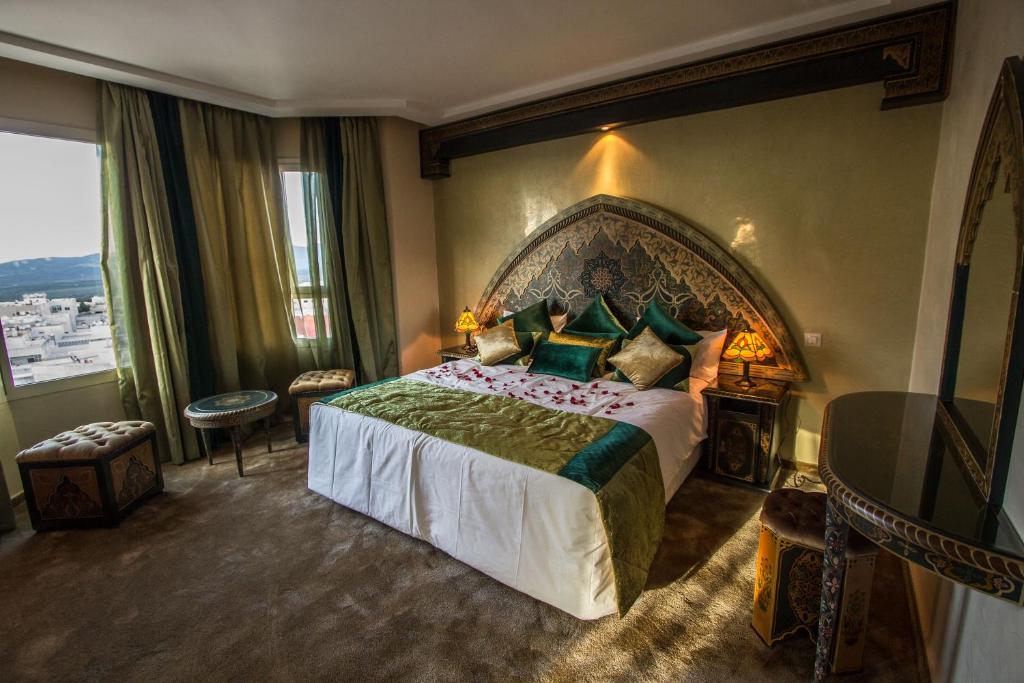 Postel nebo postele na pokoji v ubytování Hotel Tafilalet