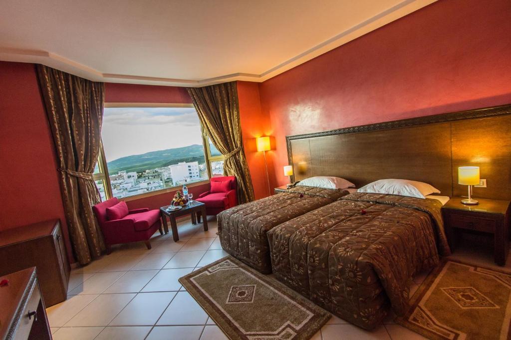 Postel nebo postele na pokoji v ubytování Hotel Tafilalet