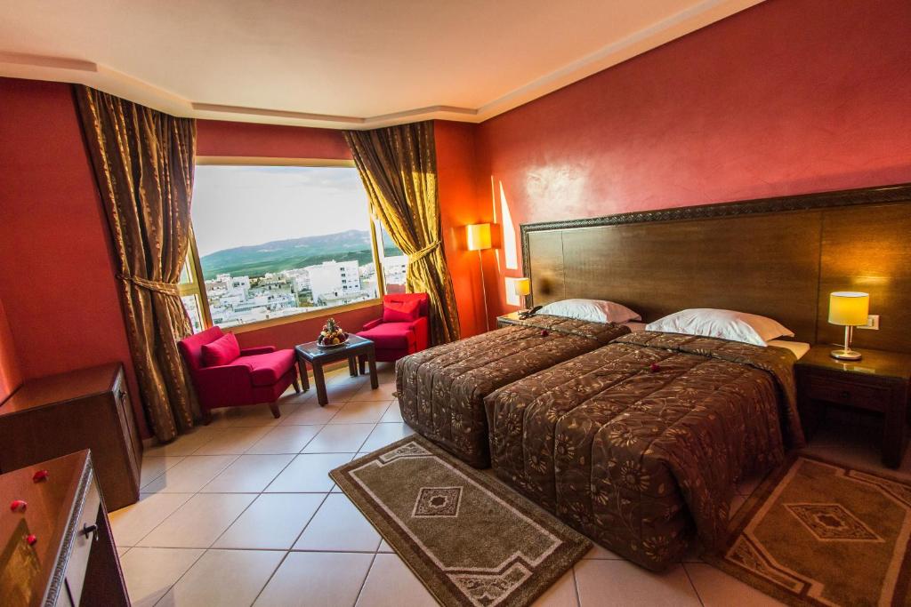 Postel nebo postele na pokoji v ubytování Hotel Tafilalet