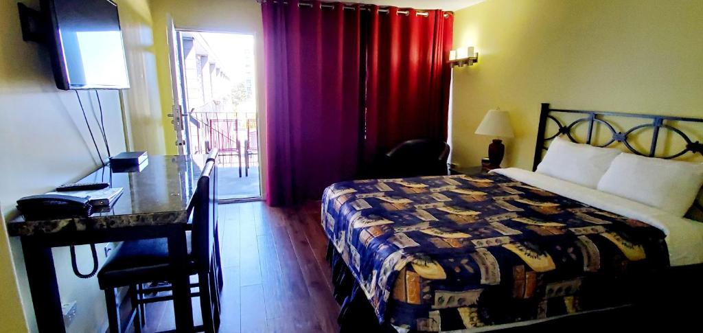 Postel nebo postele na pokoji v ubytování Port-O-Call Inn