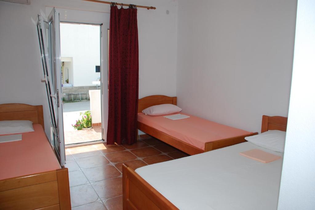 Postel nebo postele na pokoji v ubytování Guest House Nura