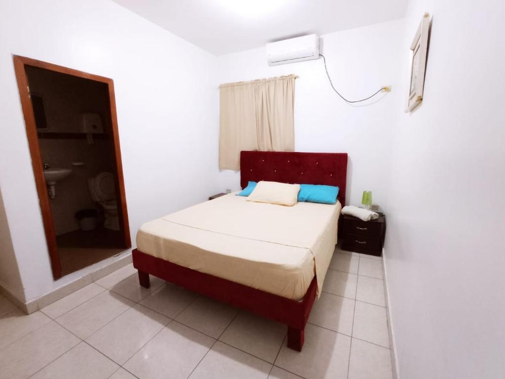 Postel nebo postele na pokoji v ubytování Hostal El Naufrago 1