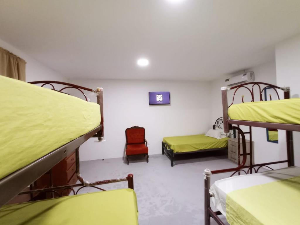 Postel nebo postele na pokoji v ubytování Hostal El Naufrago 1