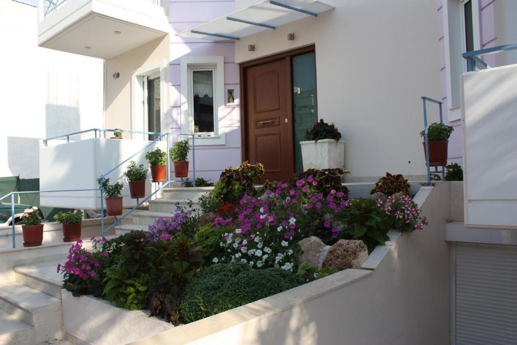 a house with flowers on the side of it at Veggie Garden Athens B&B in Athens