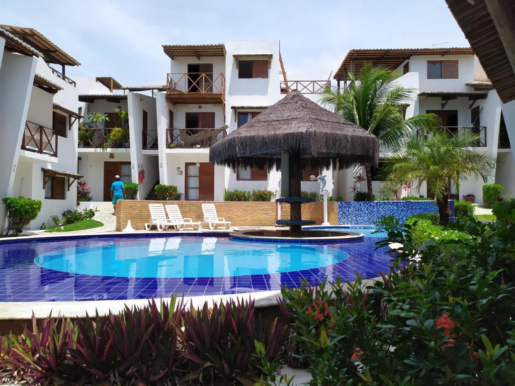 vista para a piscina no resort em Apt Recanto dos Golfinhos-Centro de Pipa em Pipa