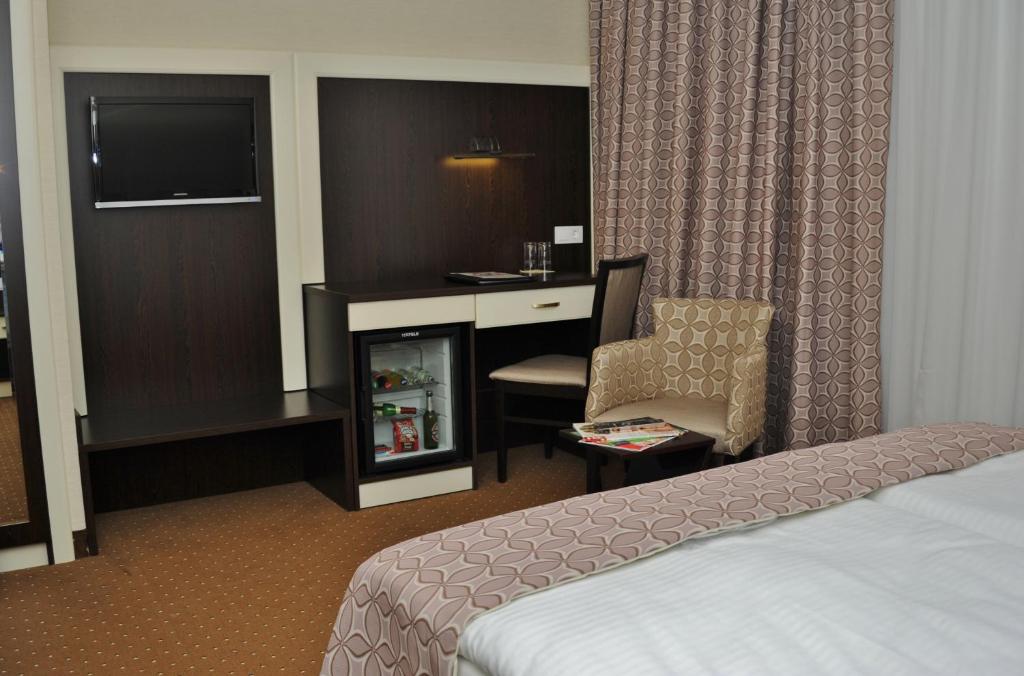 Postel nebo postele na pokoji v ubytování Hotel Atlas Halle