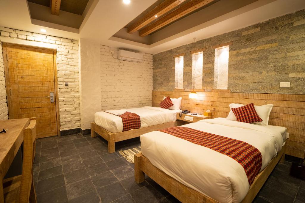 Katil atau katil-katil dalam bilik di Hotel Mera Peak Private Limited