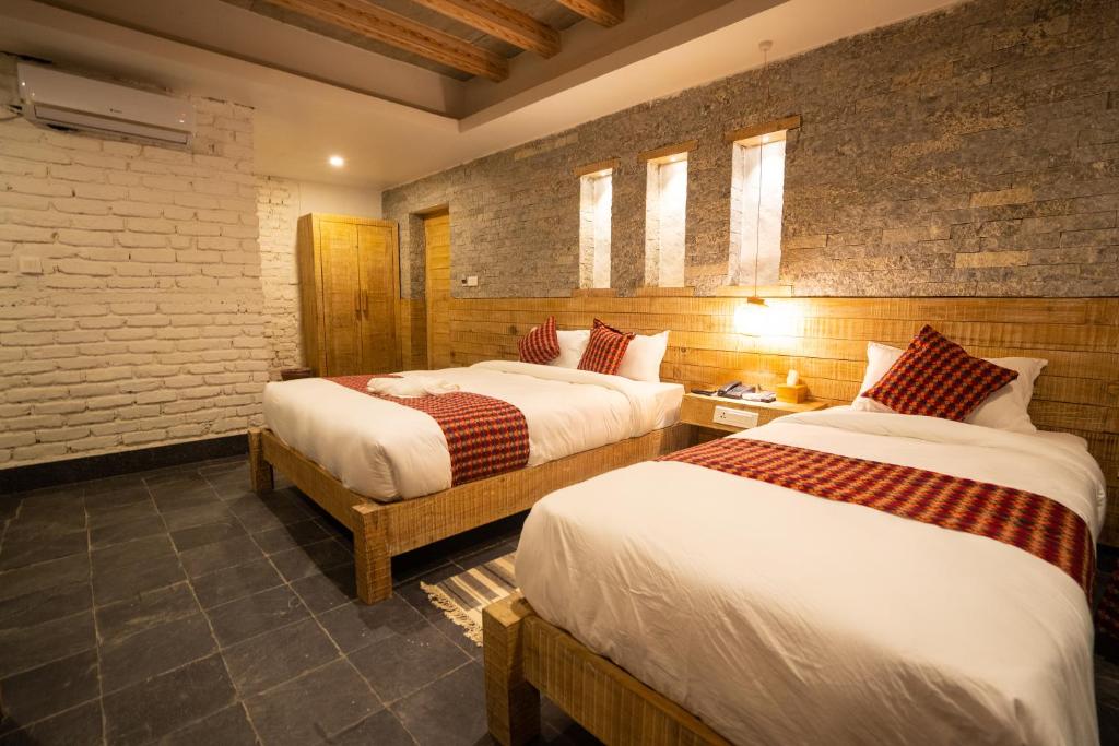 Katil atau katil-katil dalam bilik di Hotel Mera Peak Private Limited