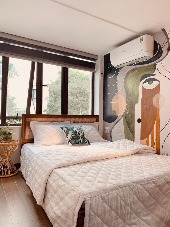 Postel nebo postele na pokoji v ubytování HnH homestay