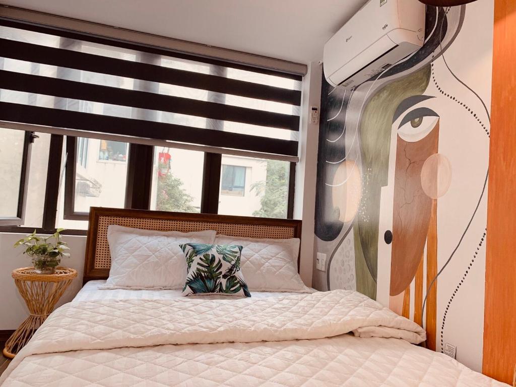 Postel nebo postele na pokoji v ubytování HnH homestay