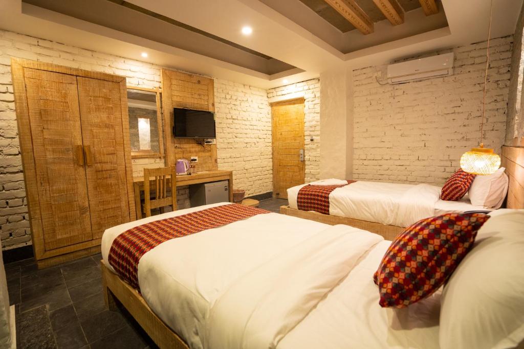 Katil atau katil-katil dalam bilik di Hotel Mera Peak Private Limited