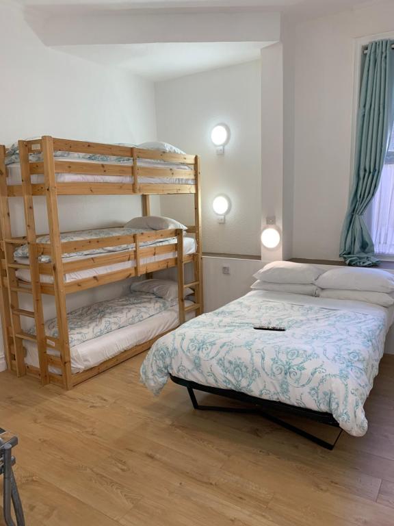 A bed or beds in a room at The Danescourt
