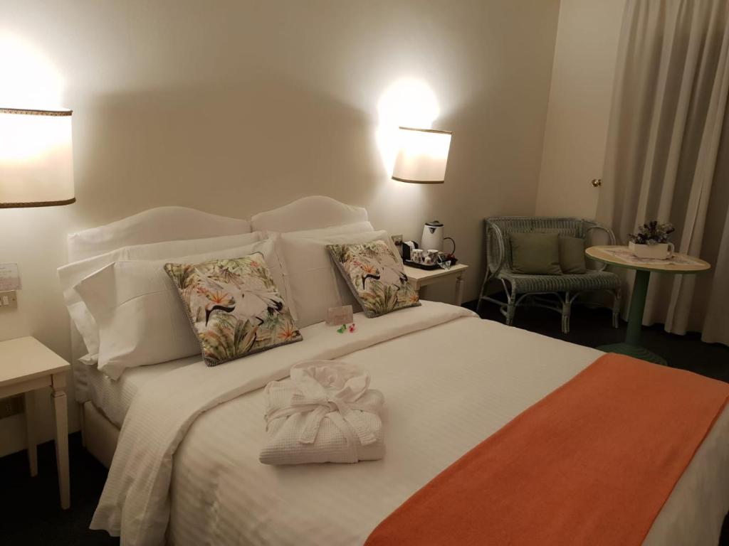 Postel nebo postele na pokoji v ubytování Albergo Al Moretto