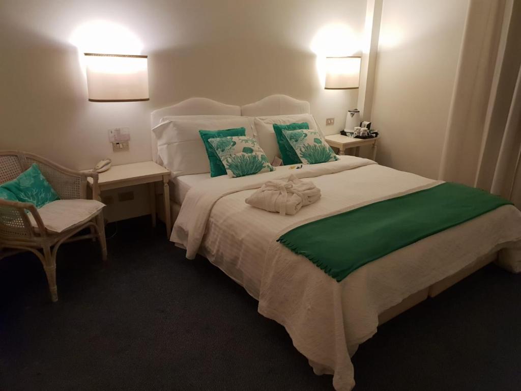 Postel nebo postele na pokoji v ubytování Albergo Al Moretto