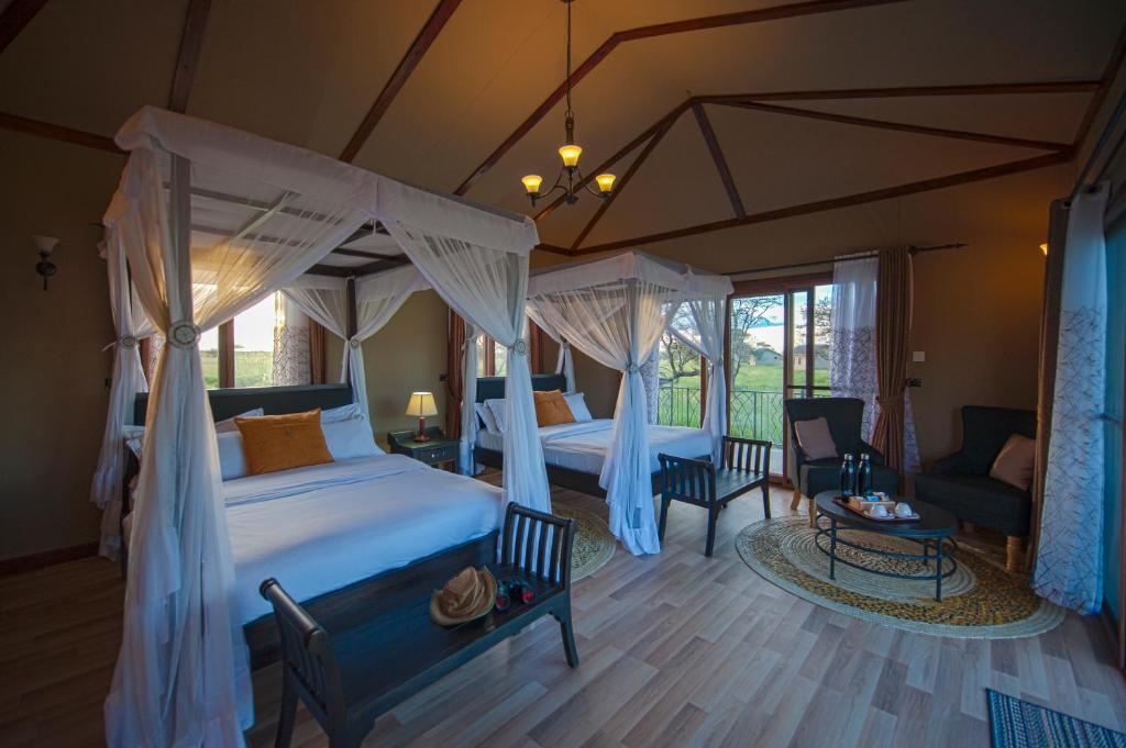 Postel nebo postele na pokoji v ubytování Serengeti Sametu Camp