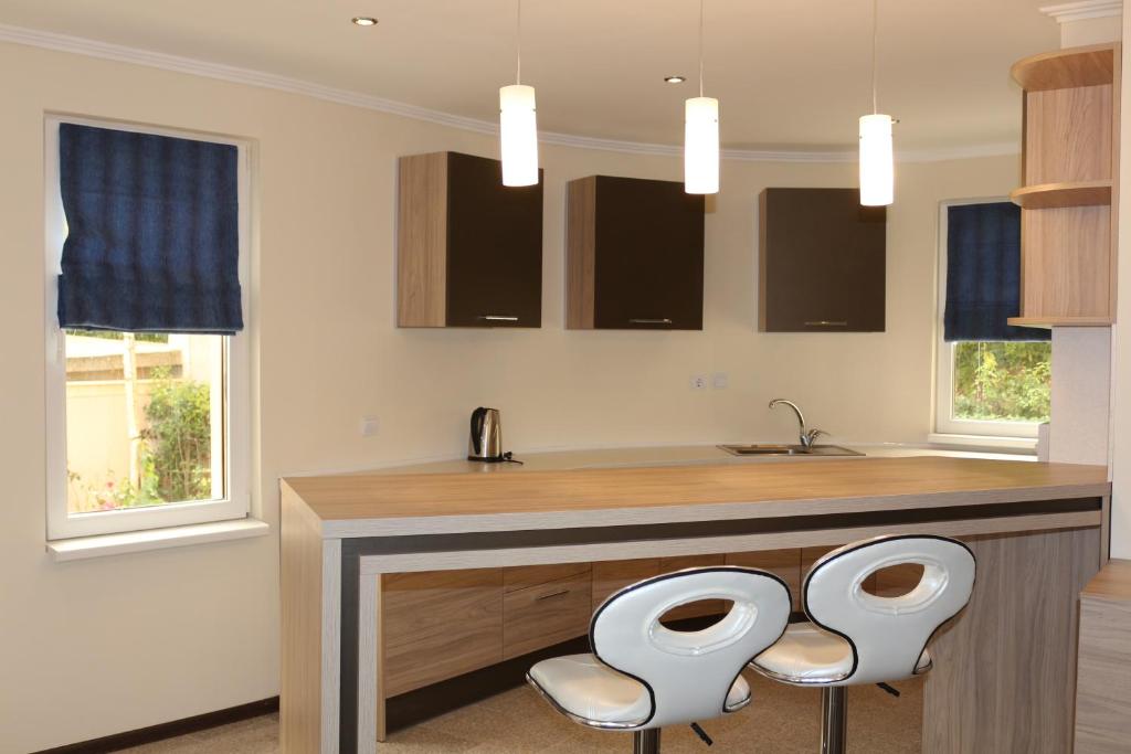 Kuchyň nebo kuchyňský kout v ubytování Vello Apartments
